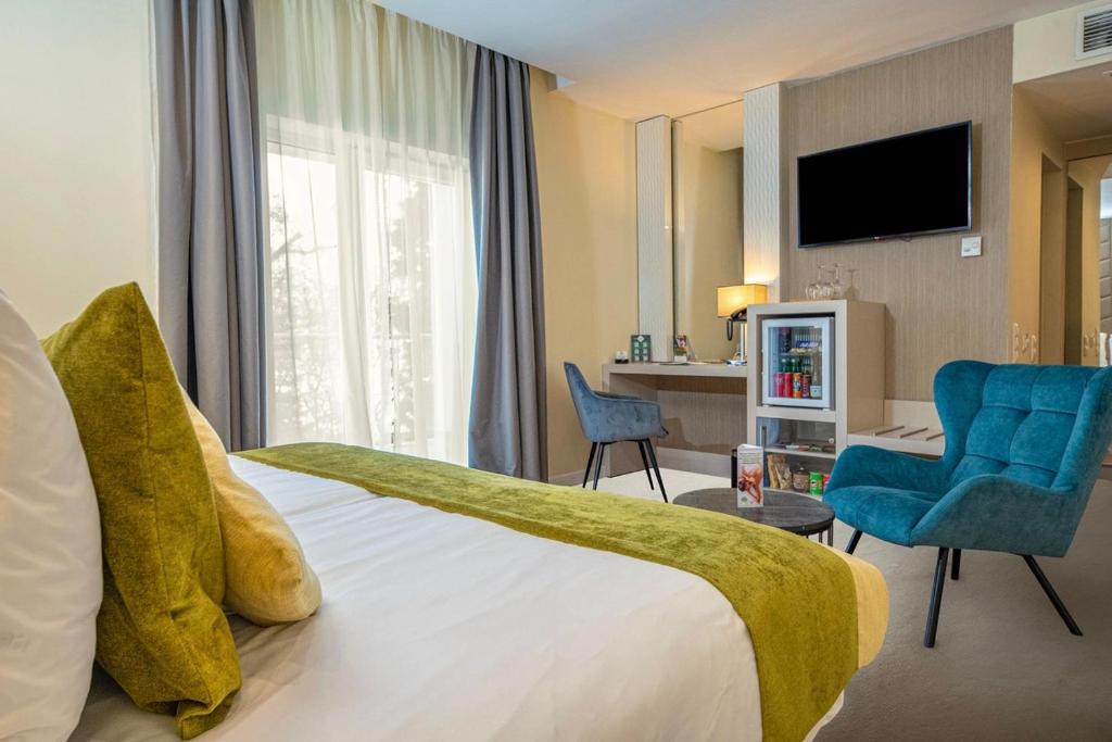 Łóżko lub łóżka w pokoju w obiekcie Hotel Ózon & Luxury Villas