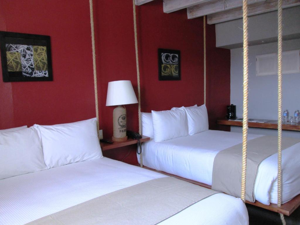 Postel nebo postele na pokoji v ubytování Hotel Damiana Boutique