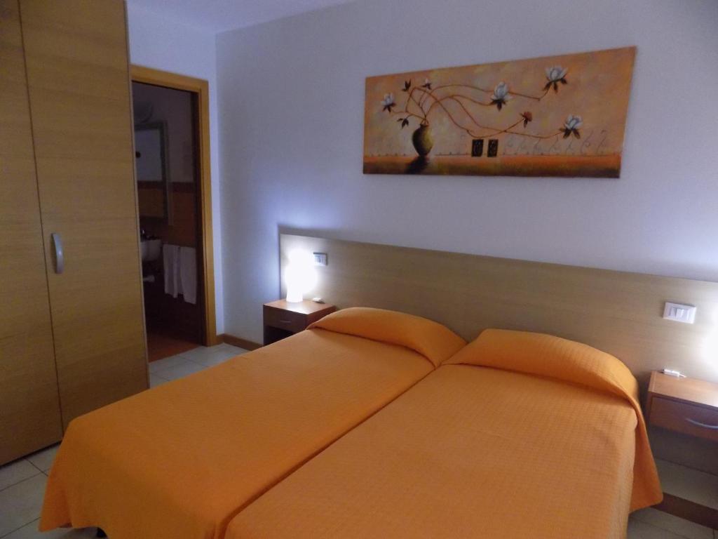 Postel nebo postele na pokoji v ubytování Hotel Residence Sole