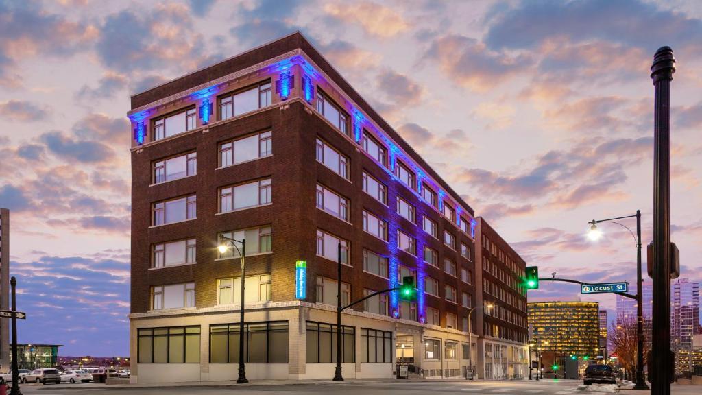 a building with blue and purple lights on it at Holiday Inn Express Kansas City Downtown in Kansas City
