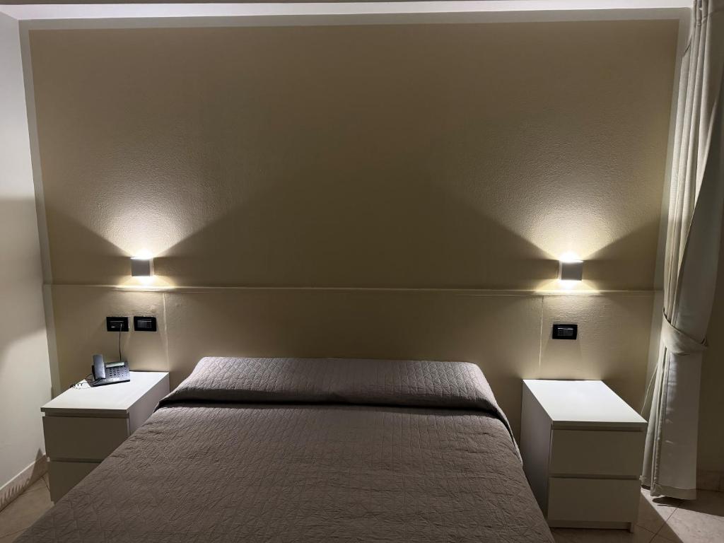 Postel nebo postele na pokoji v ubytování Hotel Cumilì