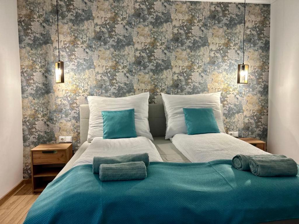 Posteľ alebo postele v izbe v ubytovaní Réz Apartmanok Gyula