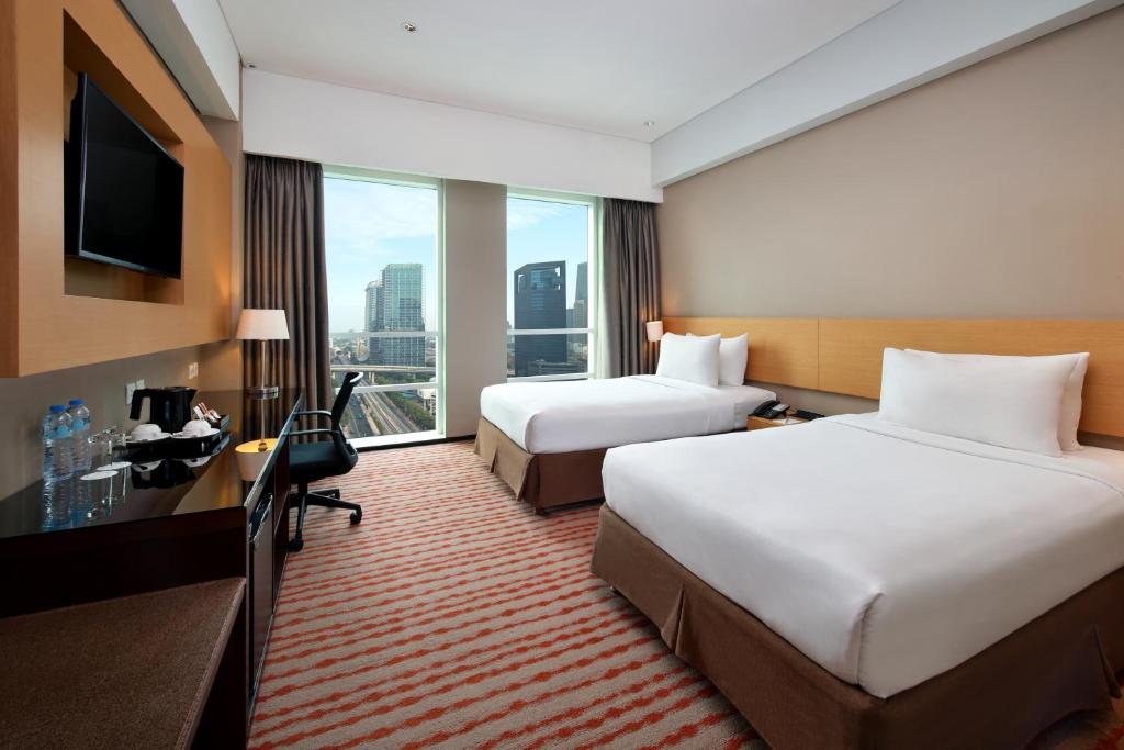Katil atau katil-katil dalam bilik di JS Luwansa Hotel & Convention Center