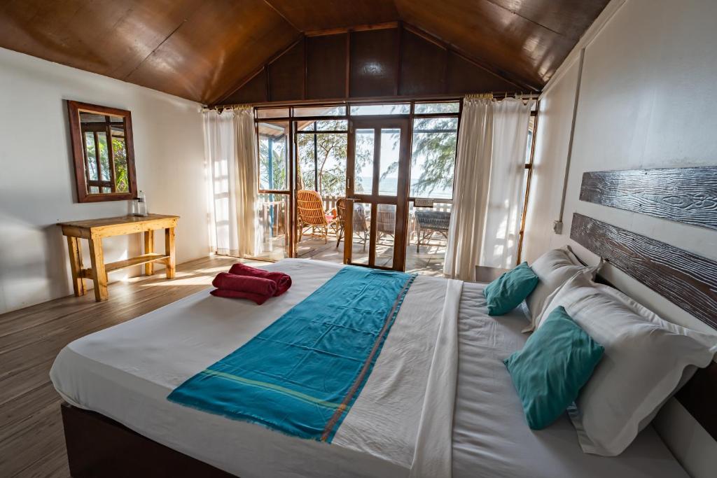 Postel nebo postele na pokoji v ubytování Peace Garden Beach Resort