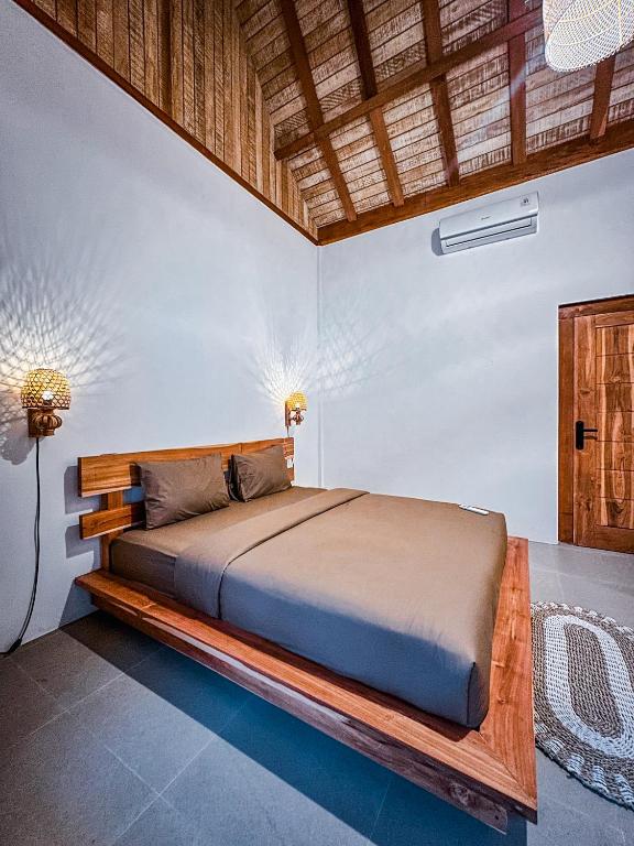 Postel nebo postele na pokoji v ubytování Makuta Villa