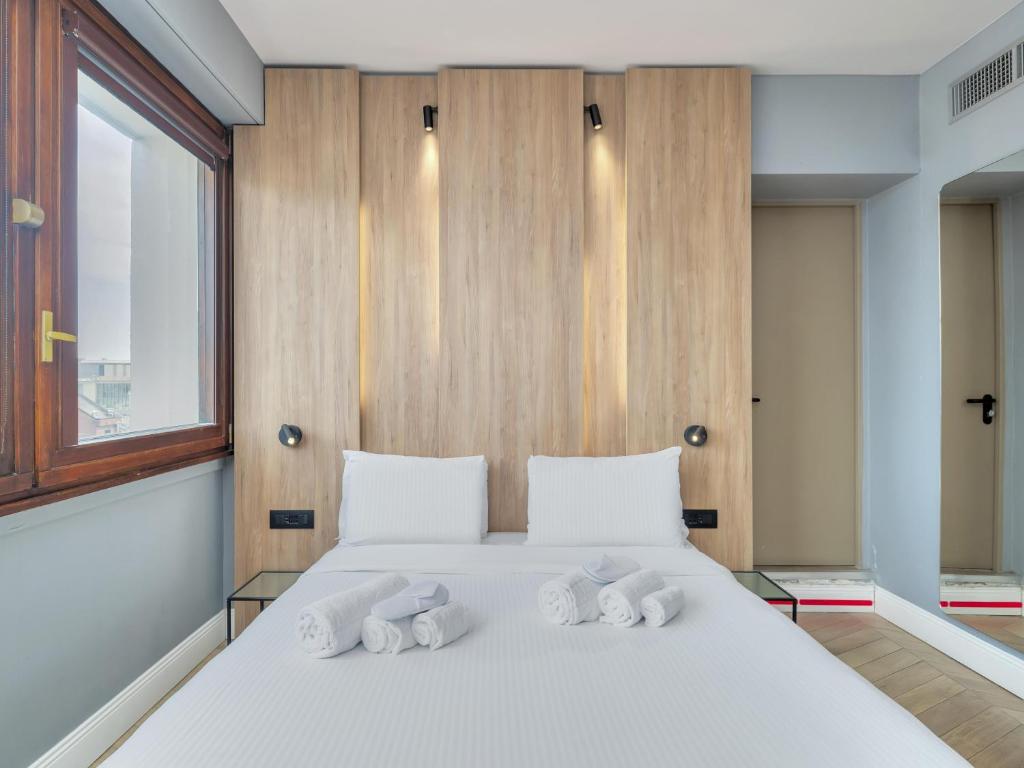 Postel nebo postele na pokoji v ubytování B&B Hotel Milano City Center Duomo
