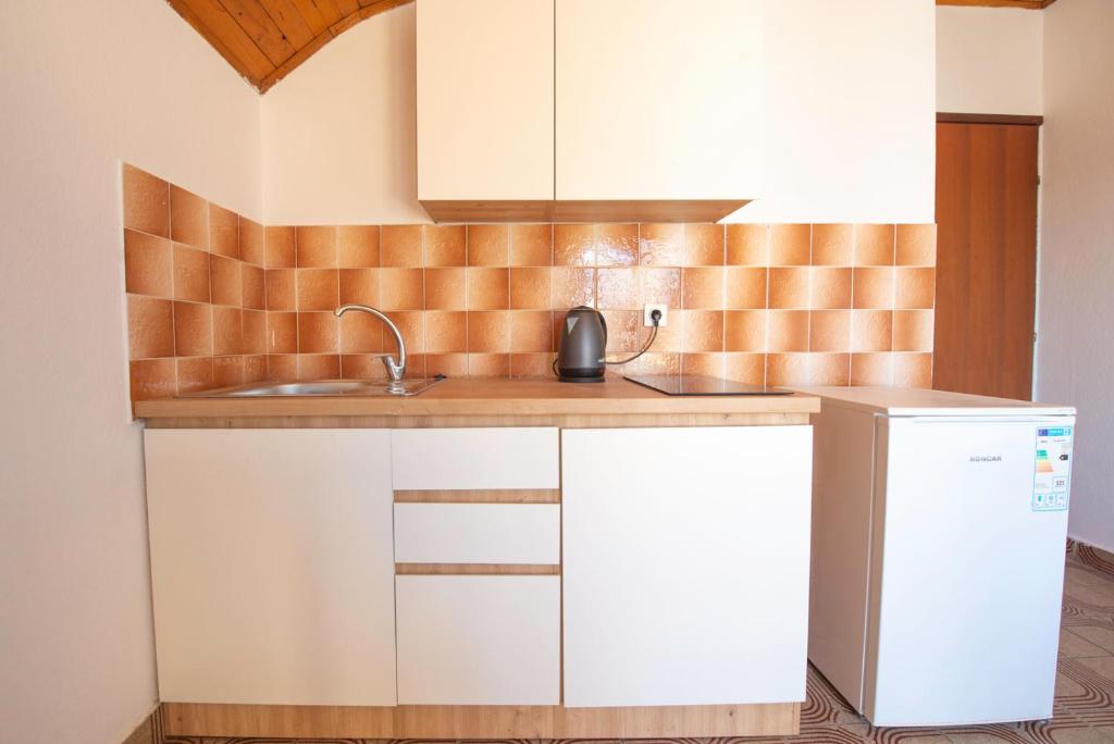 Kuchnia lub aneks kuchenny w obiekcie Apartments Matulo