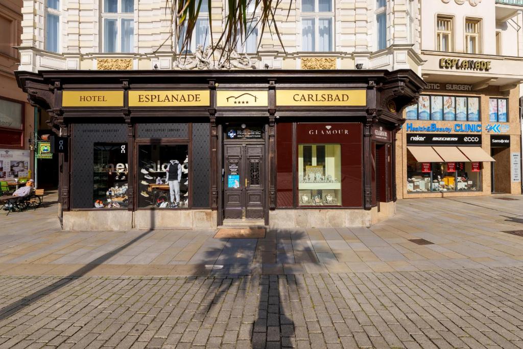 a store on a street in a city at Esplanade Carlsbad in Karlovy Vary