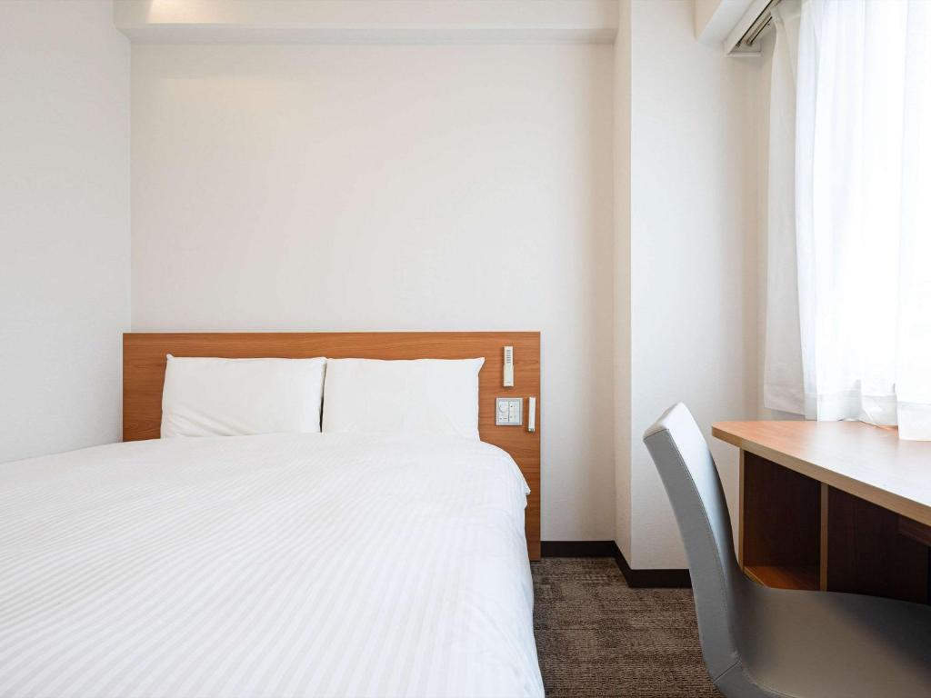 Postel nebo postele na pokoji v ubytování Comfort Inn Hitachinaka