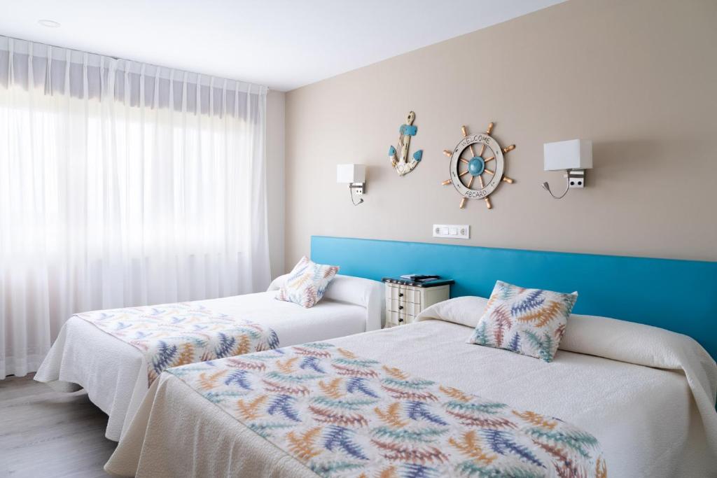 A bed or beds in a room at Hotel el Pinar