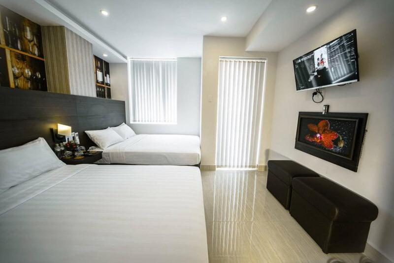 Postel nebo postele na pokoji v ubytování Duy Ninh Hotel
