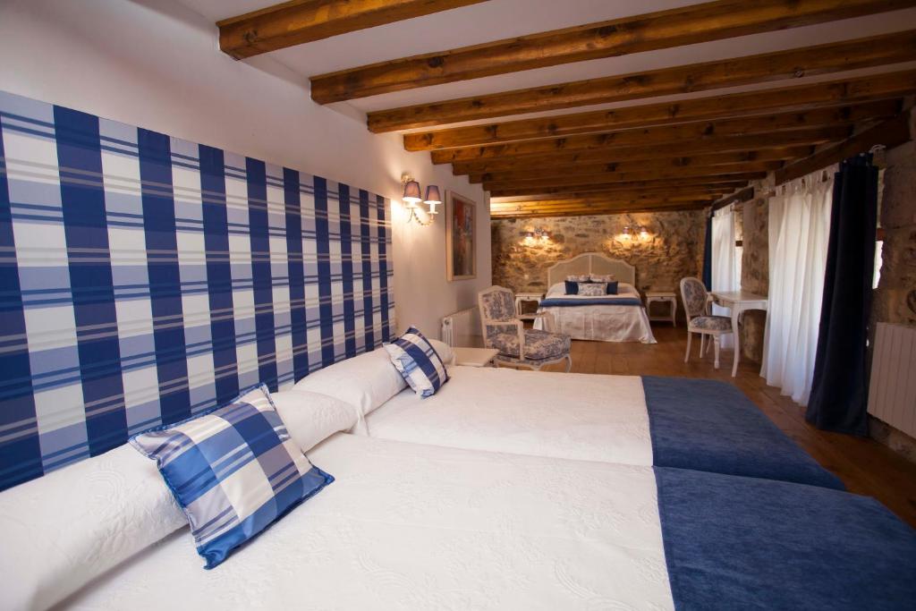 Posteľ alebo postele v izbe v ubytovaní Hotel Rural La Torre de Bisjueces
