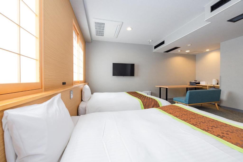 TV a/nebo společenská místnost v ubytování Hotel Takasago