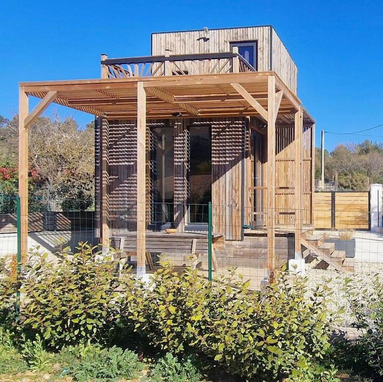 a wooden house is under construction in a field at Le LODGE De La Sainte Baume in Plan dʼAups