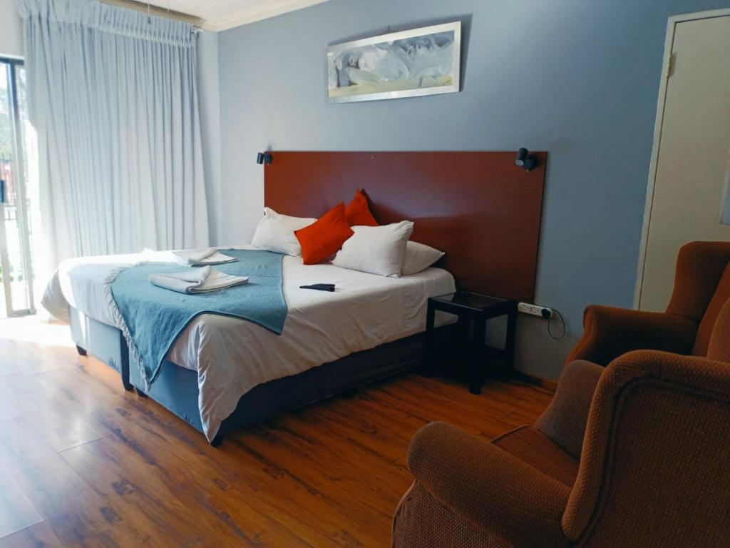 Postel nebo postele na pokoji v ubytování 21 On Coetzee Guest House
