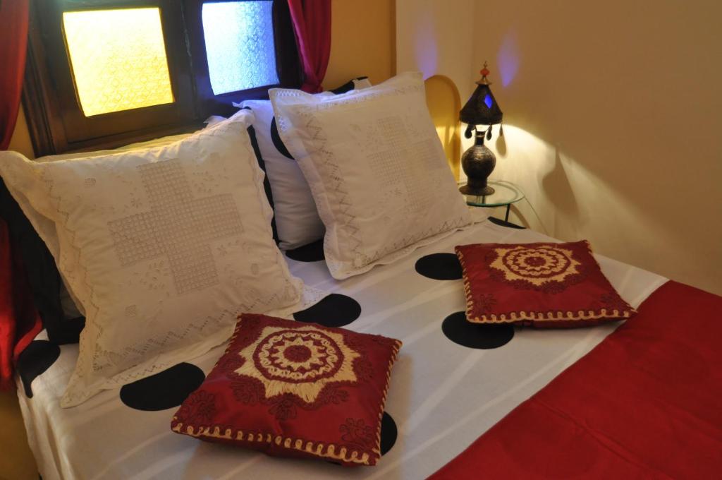 Postel nebo postele na pokoji v ubytování Riad La Famille
