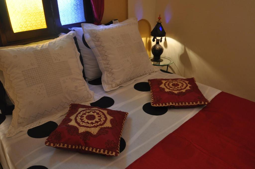 Postel nebo postele na pokoji v ubytování Riad La Famille
