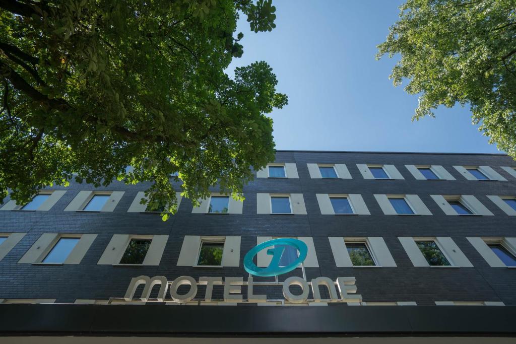 a building with the north one hotel sign on it at Motel One Hamburg Airport in Hamburg