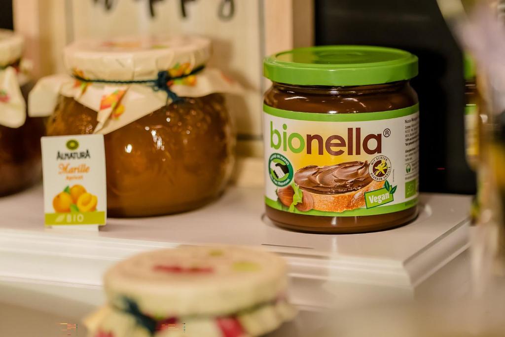 a jar of peanut butter sitting on top of a refrigerator at Motel One Hamburg Airport in Hamburg