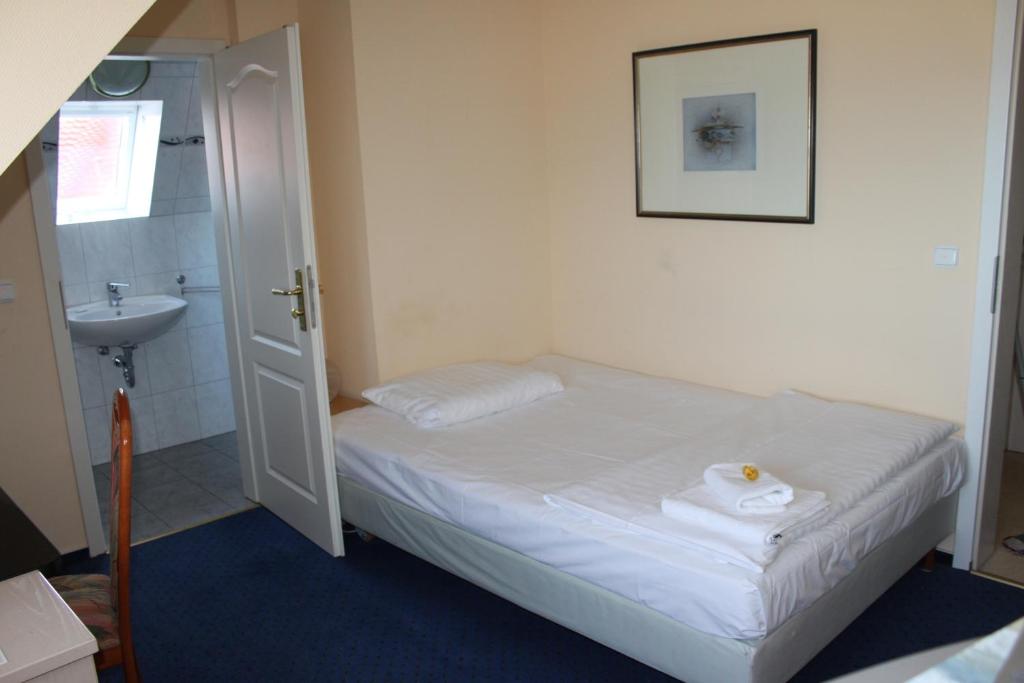 Postel nebo postele na pokoji v ubytování Hotel Stolteraa