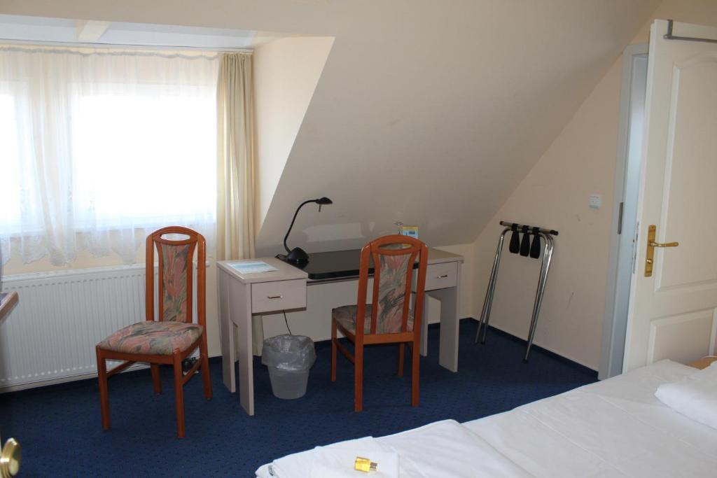 Postel nebo postele na pokoji v ubytování Hotel Stolteraa