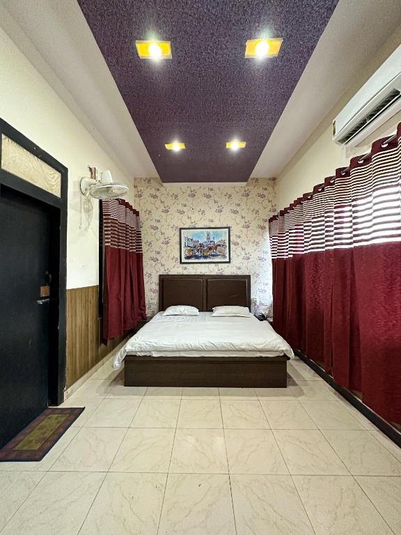 Postel nebo postele na pokoji v ubytování Hotel Ace