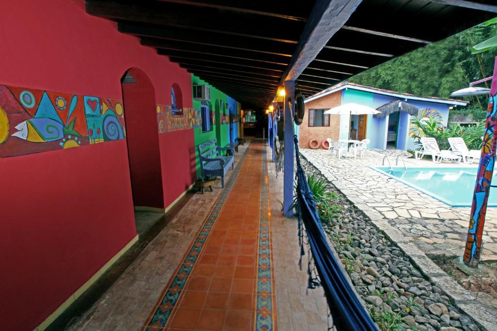 a hallway of a house with a swimming pool at Pousada do Sidão in Ilhabela