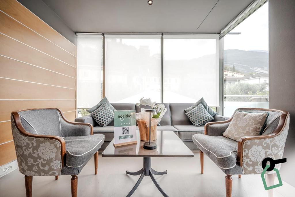Posezení v ubytování HOTIDAY Room Collection - Torbole