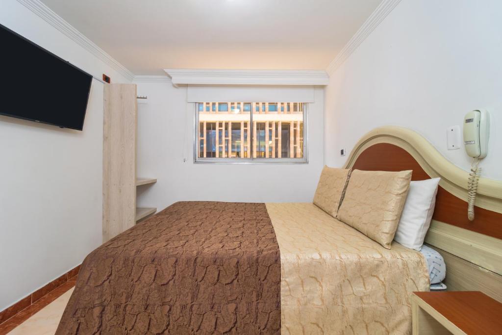Postel nebo postele na pokoji v ubytování Hotel Zulita