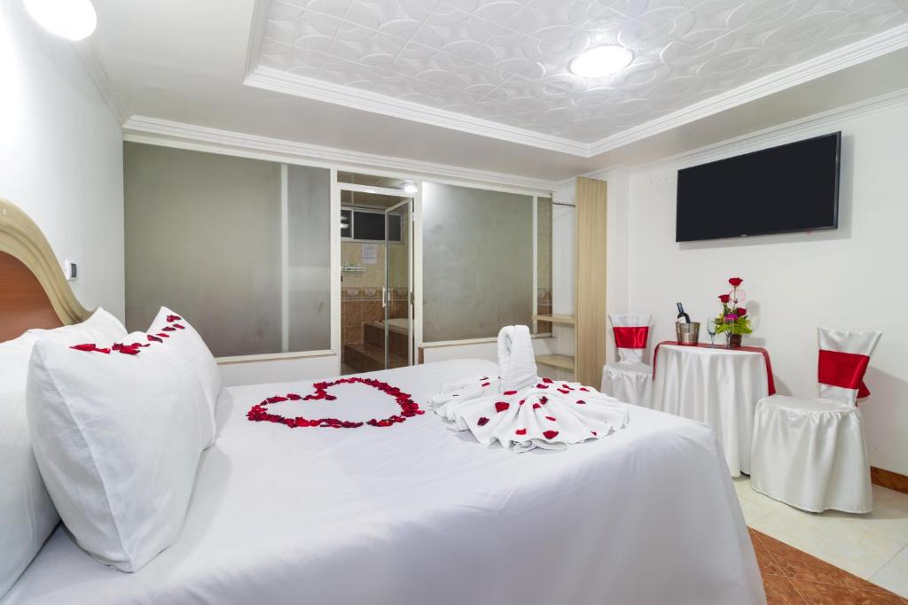 Postel nebo postele na pokoji v ubytování Hotel Zulita