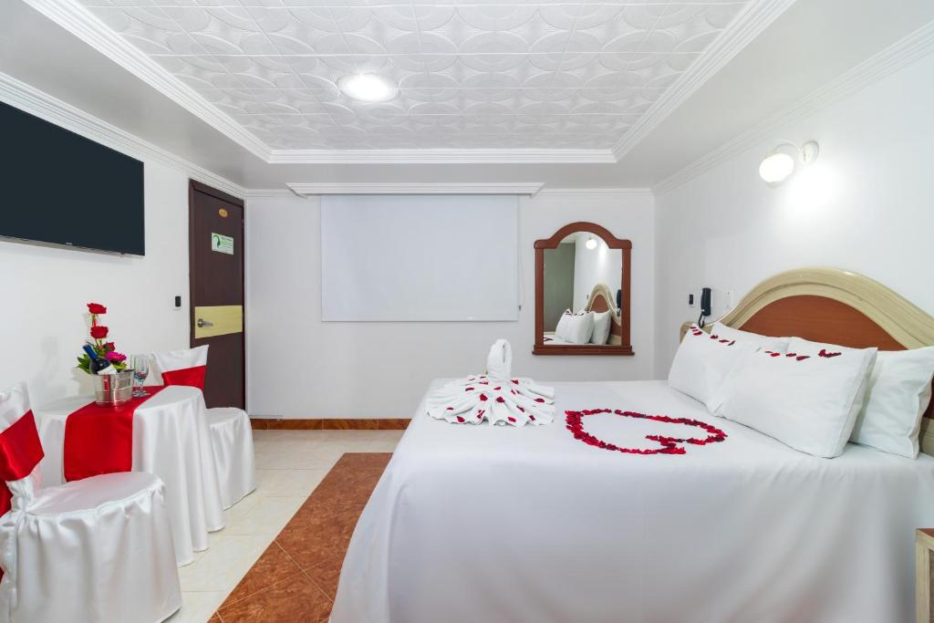 Postel nebo postele na pokoji v ubytování Hotel Zulita