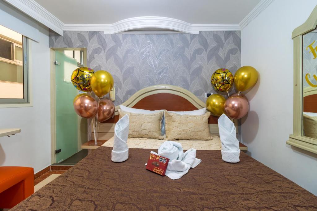 Postel nebo postele na pokoji v ubytování Hotel Zulita