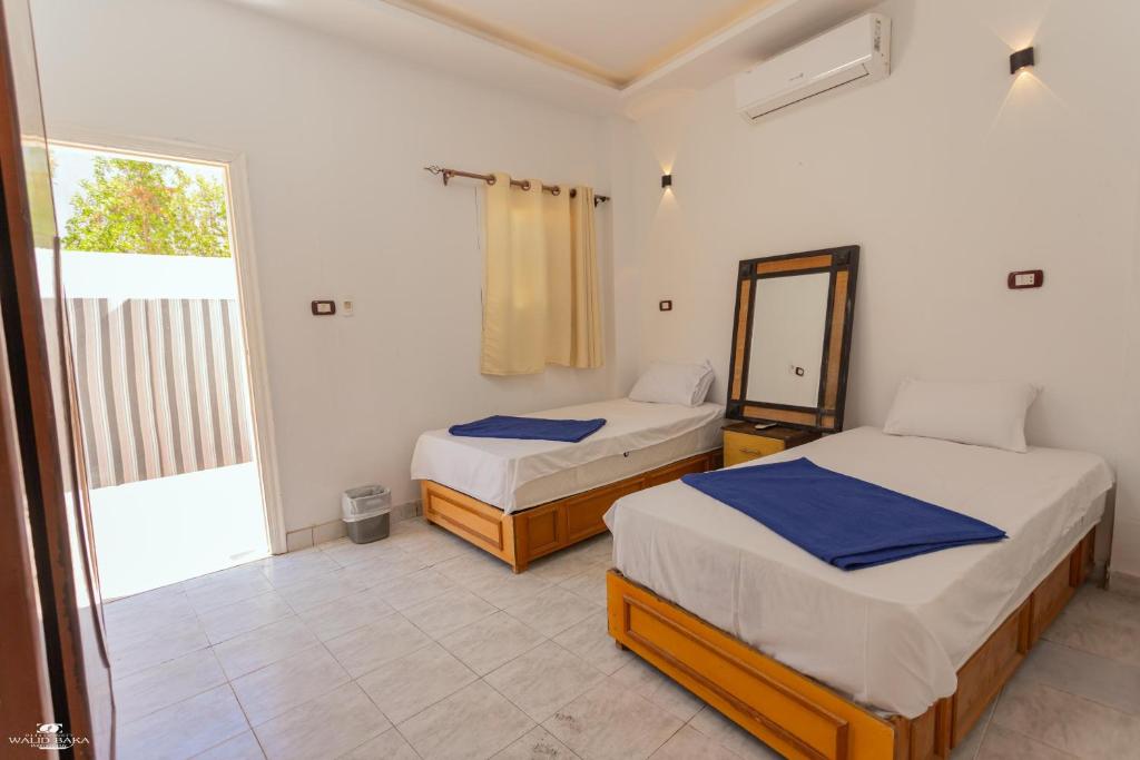 Postel nebo postele na pokoji v ubytování Home Hotel Dahab