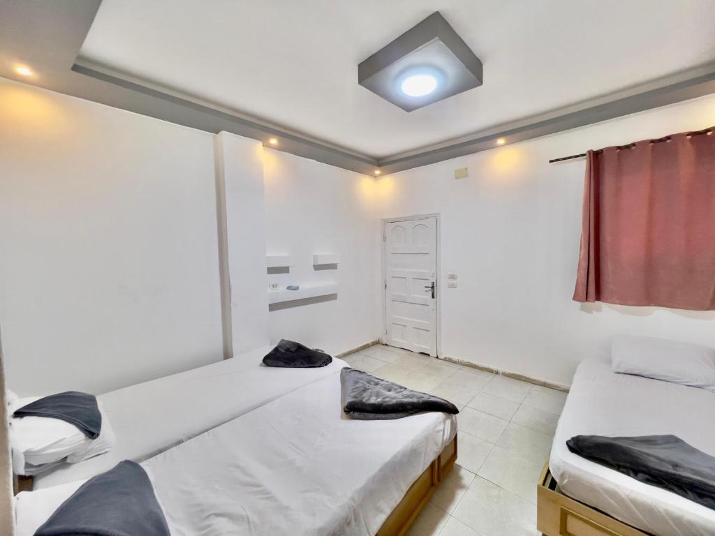 Postel nebo postele na pokoji v ubytování Home Hotel Dahab