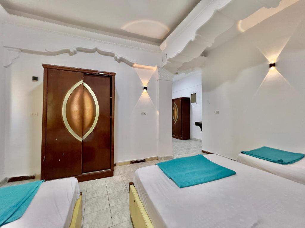 Postel nebo postele na pokoji v ubytování Home Hotel Dahab