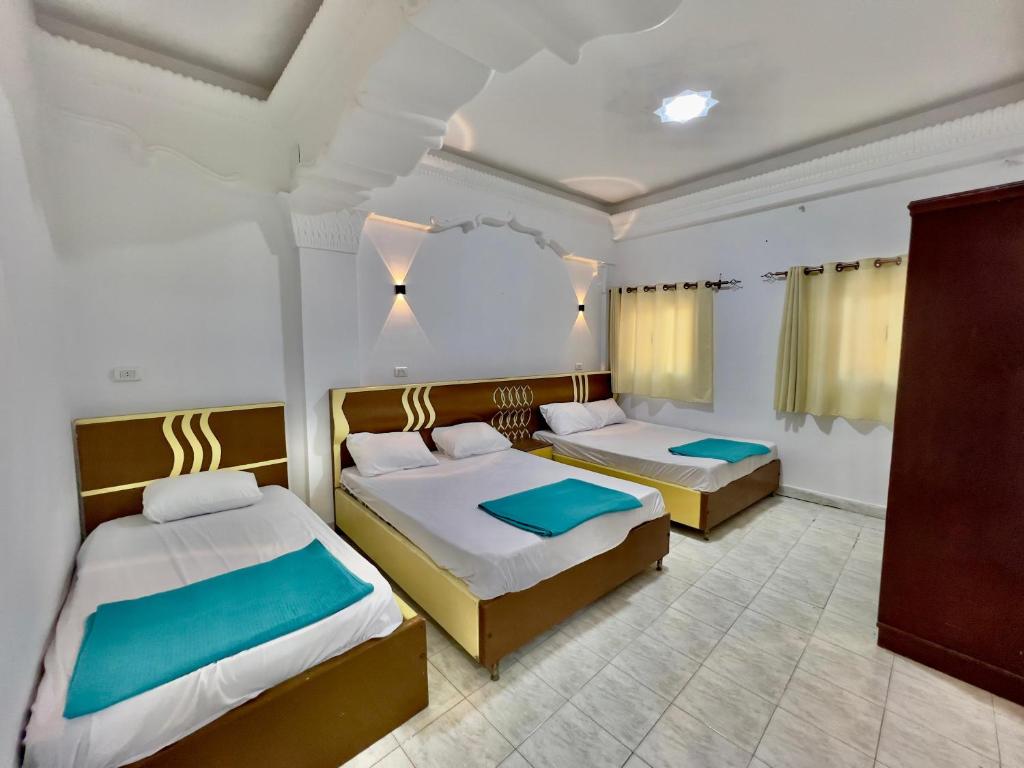 Postel nebo postele na pokoji v ubytování Home Hotel Dahab