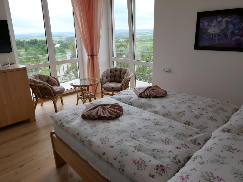 Postel nebo postele na pokoji v ubytování Penzion Renesance