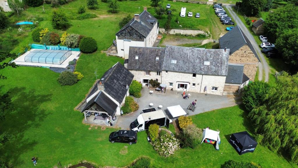 an aerial view of a large house with a garage at Domaine de Cantelou in Clécy