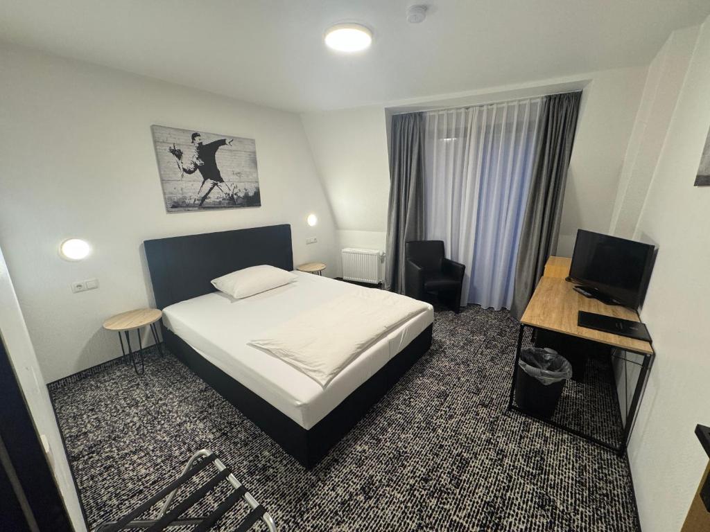 Postel nebo postele na pokoji v ubytování Panorama Hotel Rheinkrone