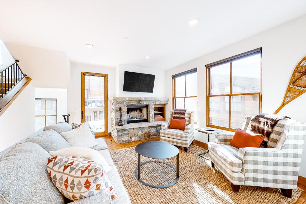 a living room with a couch and a fireplace at Trail Creek View in Ketchum