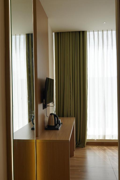 TV a/nebo společenská místnost v ubytování Dn hotel