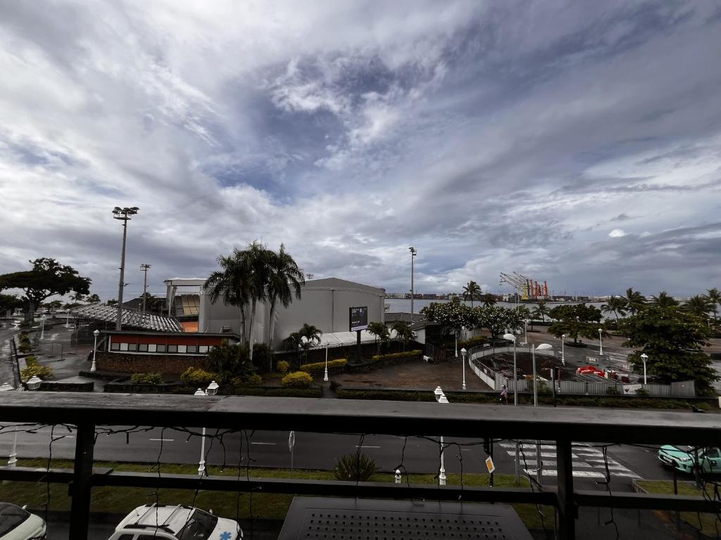 a view of a parking lot with a cloudy sky at NEW My Lodge - Parking, AC, Netflix & Wifi in Papeete