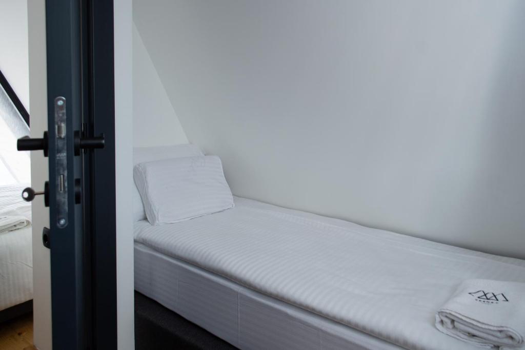 Postel nebo postele na pokoji v ubytování Kremna Concept