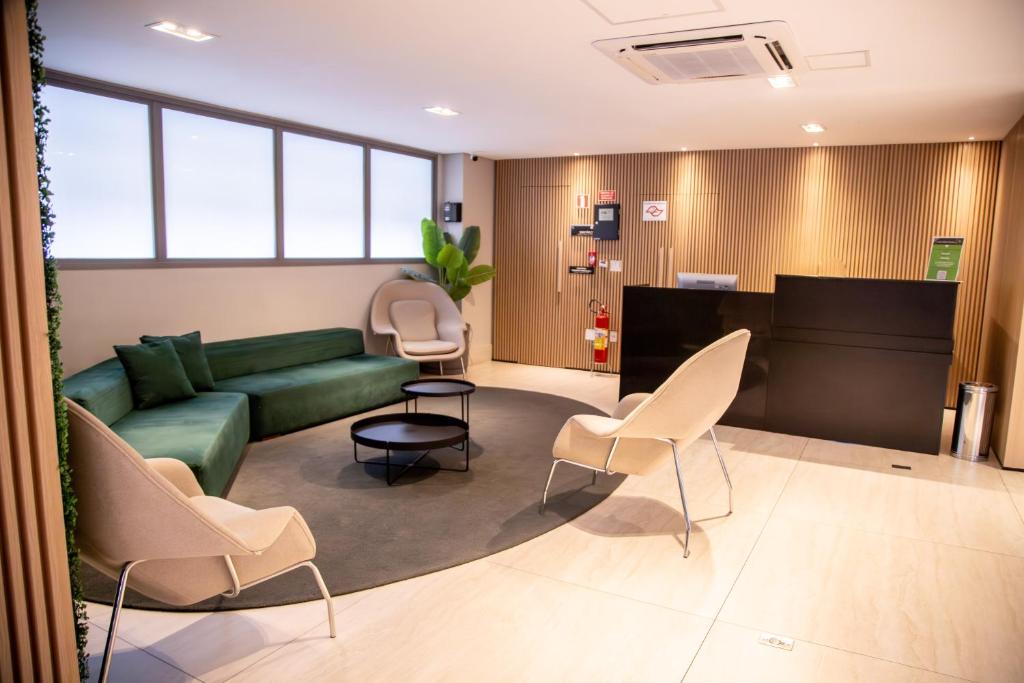 Posezení v ubytování Cozzy Suites Paraíso Hotel
