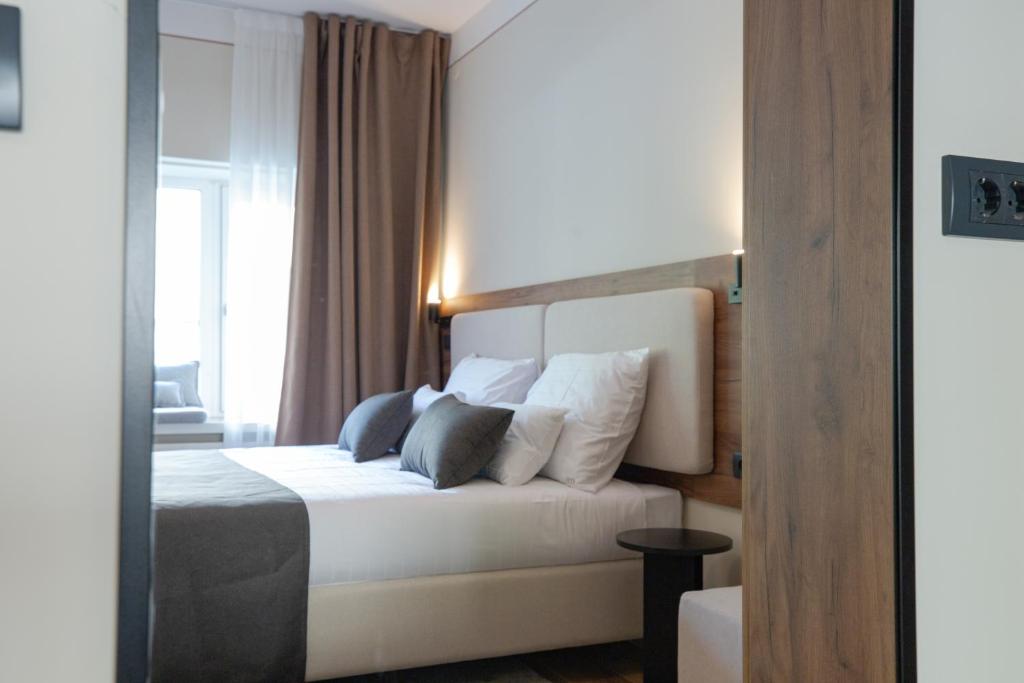 Postel nebo postele na pokoji v ubytování Simma Luxury Apartments & Rooms