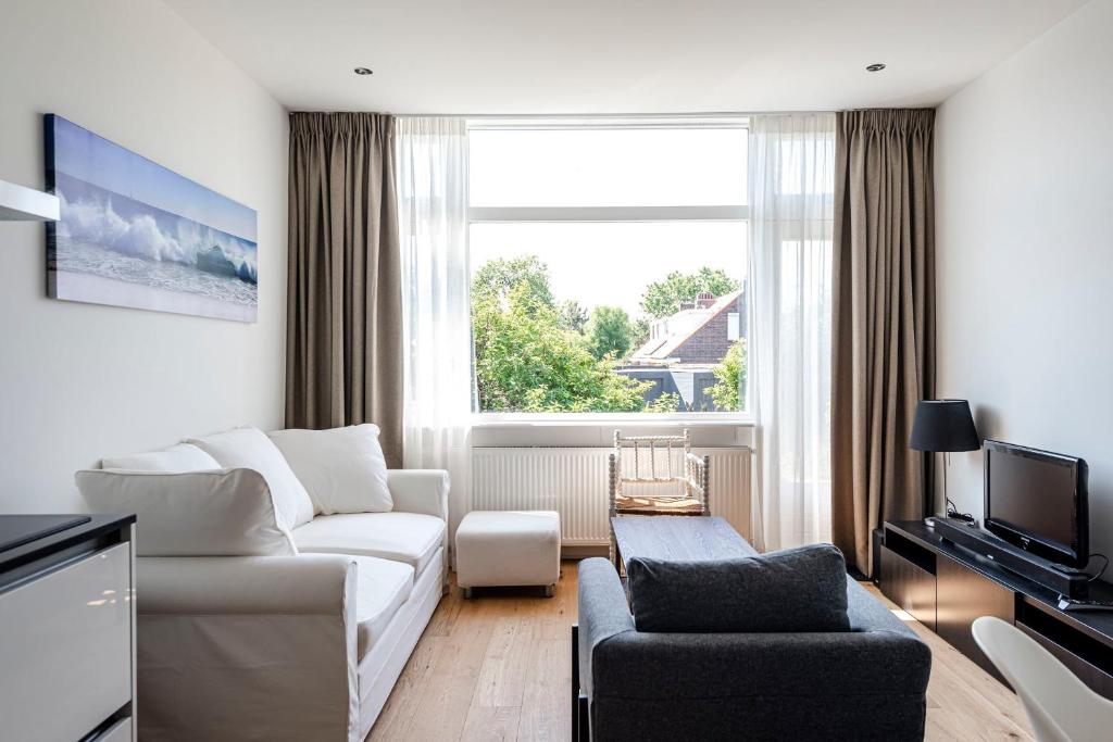 Телевизор и/или развлекательный центр в The apartment Shell 42