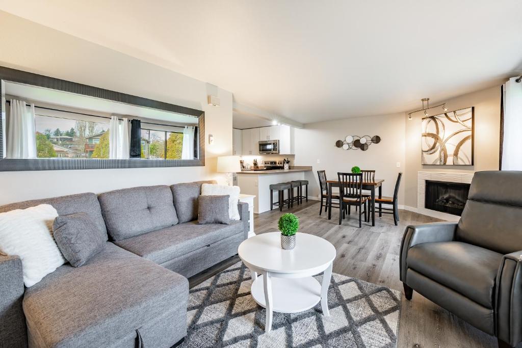 a living room with a couch and a table at Modern Condo with Family-Friendly Hot Tub 102 in Blaine