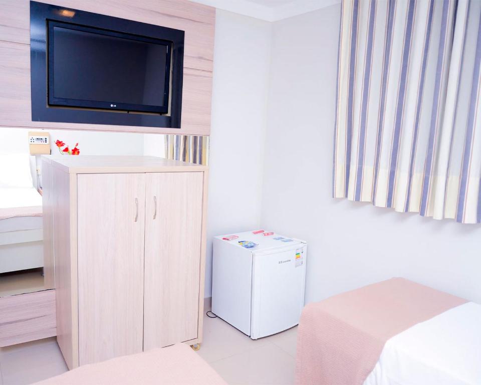 Postel nebo postele na pokoji v ubytování Hotel Sempre Bahia