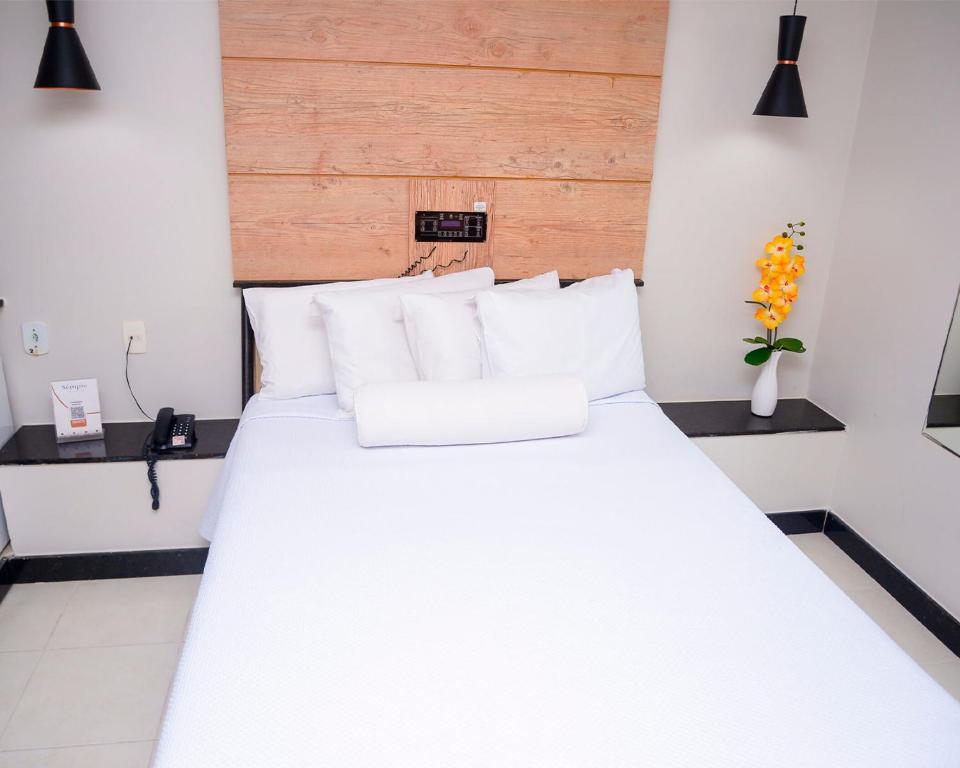Postel nebo postele na pokoji v ubytování Hotel Sempre Bahia