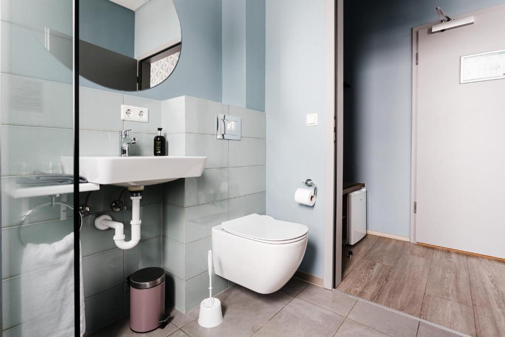 Koupelna v ubytování ODDSSON Midtown Hotel